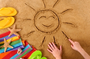 Beach with smiling sun